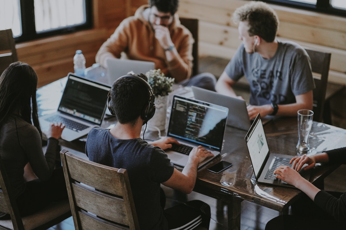 Editorial team collaborating around a conference table